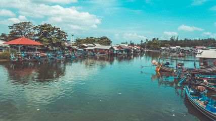 A canal boat and rural house.