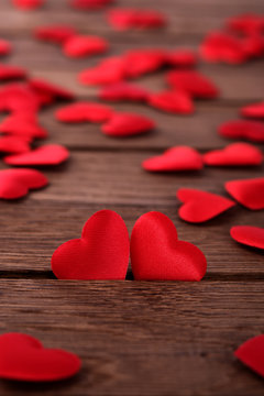 Two hearts on wooden background