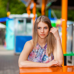 Young sexy woman walking on the street. Outdoors, lifestyle portrait. beautiful girl posing at the fair
