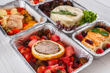 Healthy food take away, top view at wood background