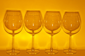 4 Empty wine glasses making shadow