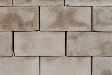 stack of concrete blocks, construction site. Grey bricks in a row for the production