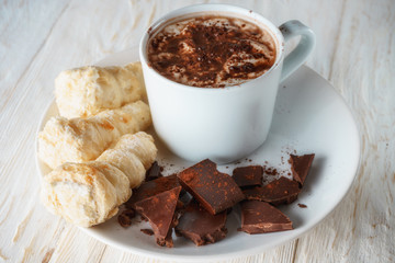 Cup of cocoa and dessert