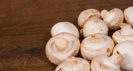 Mushrooms on wooden table with copy space. top view