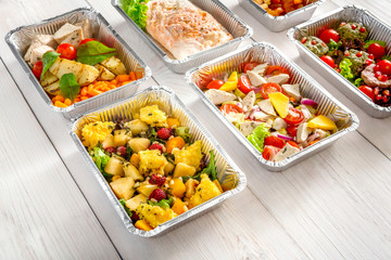 Healthy food take away, top view at wood background
