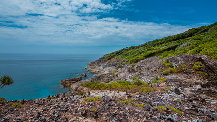 Fototapeta na wymiar Rocks cliff turquoise seascape scenery background in vintage style.