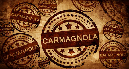 Carmagnola, vintage stamp on paper background