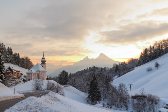 Sunset at Maria Gern Berchtesgaden, Bavaria with Watzman in winter with snow and clouds
