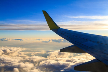View from airplane window at the clouds