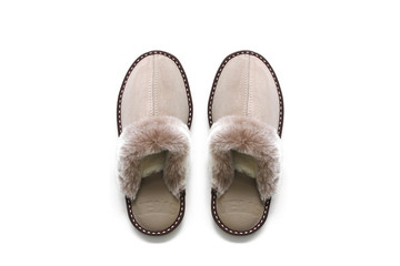 Sheepskin slippers isolated on white background