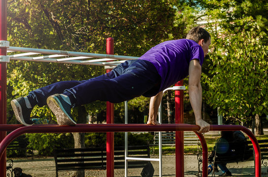 playing sports on the parallel bars