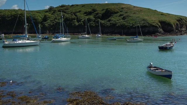 epic timelapse shot filmed over 7 hours of  the port of Solva in Wales. during this long period of time the water empties out of the bay into the sea leaving the boats stranded in sand