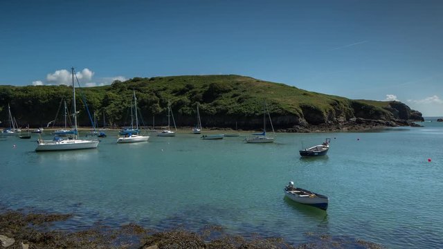 epic timelapse shot filmed over 7 hours of  the port of Solva in Wales. during this long period of time the water empties out of the bay into the sea leaving the boats stranded in sand