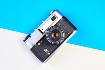 Retro camera. FED, Amateur, Zenith. Blue background