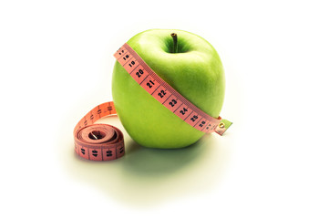 Green apple with centimeter - losing weight