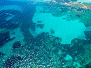 Fototapeta na wymiar Aerial view of turquoise water of mediterranean sea in Corsica -