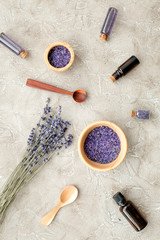 Fototapeta na wymiar Essential oil and lavender salt with flowers top view