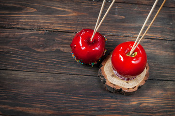 Hand dipped caramel apple covered with multi color sprinkles