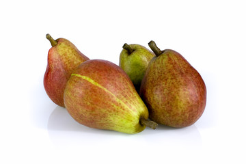 Four ripe pears isolated on white background. Still-life picture taken in studio with soft-box.