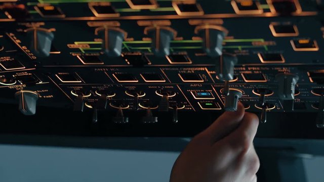 Close shot of overhead panel of modern aircraft. Captain or first pilot switch external lights buttons and knobs. Interior of Airbus A319 A320 A321