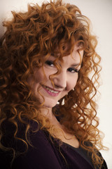 Fototapeta premium The red-haired girl posing in the studio 6