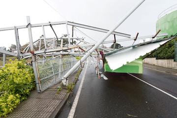 billboard demolished by wind in the highway in stormy day