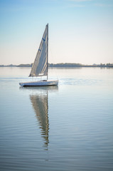 Sailboat docked on the water