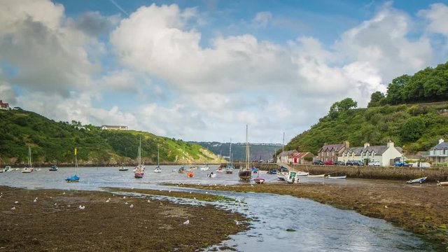 epic timelapse shot filmed over 7 hours of  the port of Solva in Wales. during this long period of time the water empties out of the bay into the sea leaving the boats stranded in sand