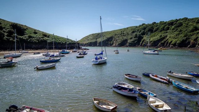 epic timelapse shot filmed over 7 hours of  the port of Solva in Wales. during this long period of time the water empties out of the bay into the sea leaving the boats stranded in sand