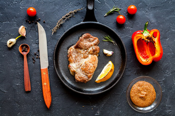 concept cooked steak on dark background top view