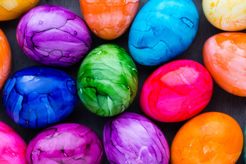 Easter eggs painted in colors on a pattern background.