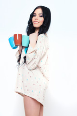 smiling pretty sexy girl with coffee cups isolated on white
