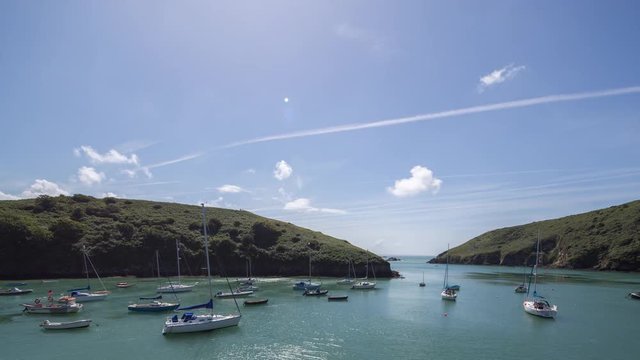 epic timelapse shot filmed over 7 hours of  the port of Solva in Wales. during this long period of time the water empties out of the bay into the sea leaving the boats stranded in sand