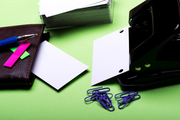 stationery for office: hole puncher, clips, blanks, wallet, pen, stickers