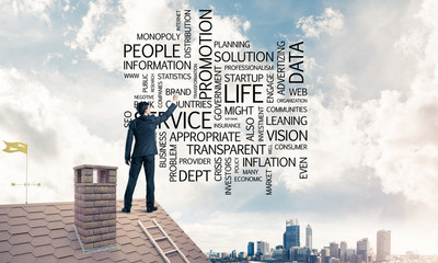 Young businessman standing on house roof and writing leadership 