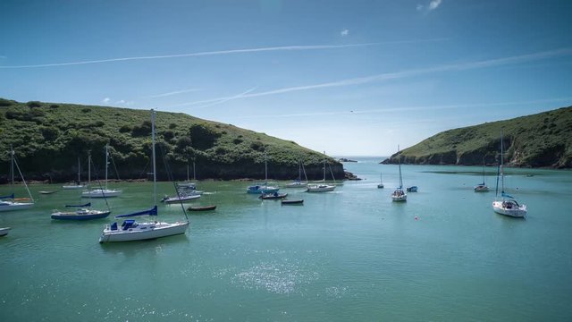 epic timelapse shot filmed over 7 hours of  the port of Solva in Wales. during this long period of time the water empties out of the bay into the sea leaving the boats stranded in sand