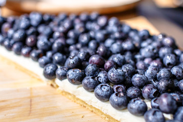 Fresh blueberries on the cake type tart.