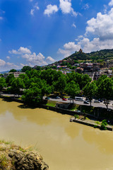 Fototapeta na wymiar Beautiful city landscape with Kura(Mtkvari) river, Tbilisi, Georgia
