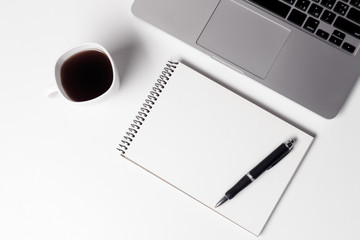 Cup With Coffe And Notebook With Pen Near Laptop  