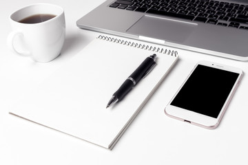 Cup With Coffee, Notebook With Pen And Smartphone Near Laptop 