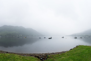 View on Loch Goilhead with boats and mist, Scotland, Great-Brita