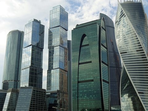 НЕБОСКРЁБЫ,СОВРЕМЕННАЯ АРХИТЕКТУРА,МЕГАПОЛИС,СТЕКЛО,СТЕНЫ,ГОЛУБОЙ ФОН,КРАСОТА