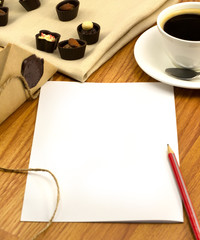 blank page and pencil to write messages on the desktop. Envelope