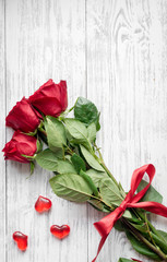 Fototapeta na wymiar concept Valentine's Day with flower wooden background top view