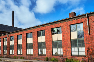 Abandoned factory hall with red brick in Gniezno.