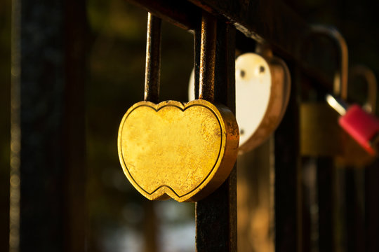 lock for keys in the form of heart hanging on the fence, love, V