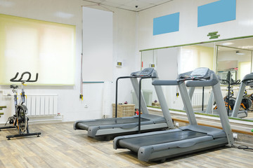 Fototapeta na wymiar The image of treadmills in fitness hall