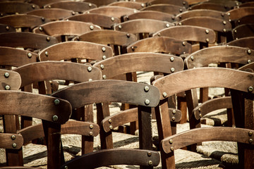 Many empty chairs waiting as background