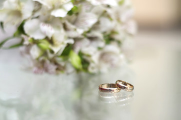Wedding rings on a glass table