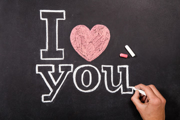 Black chalkboard with text I love you